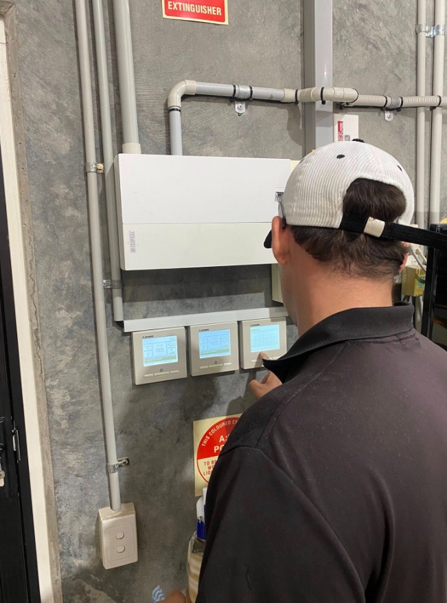 Technician checking equipment